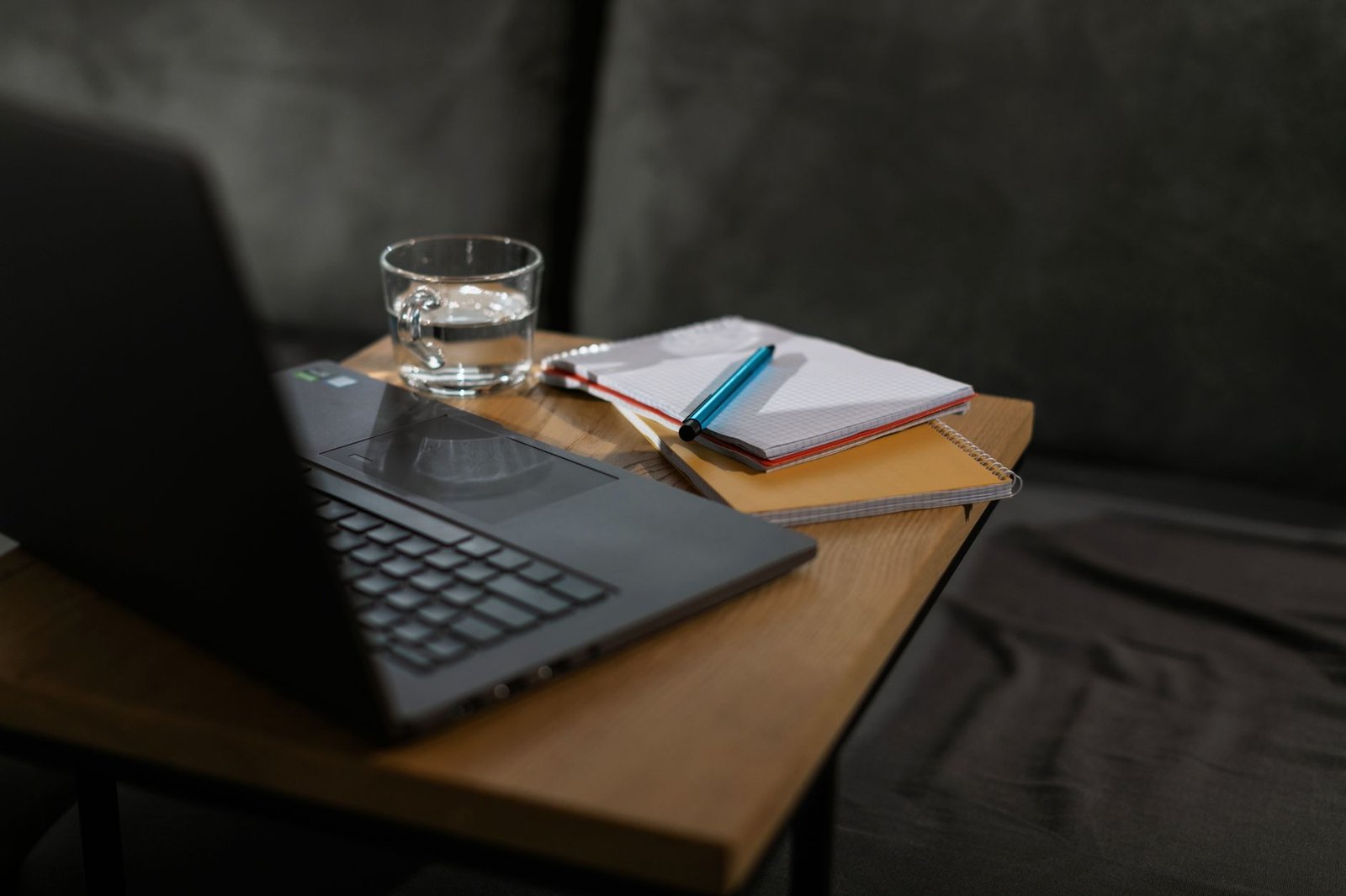 Desk with a laptop and notebook